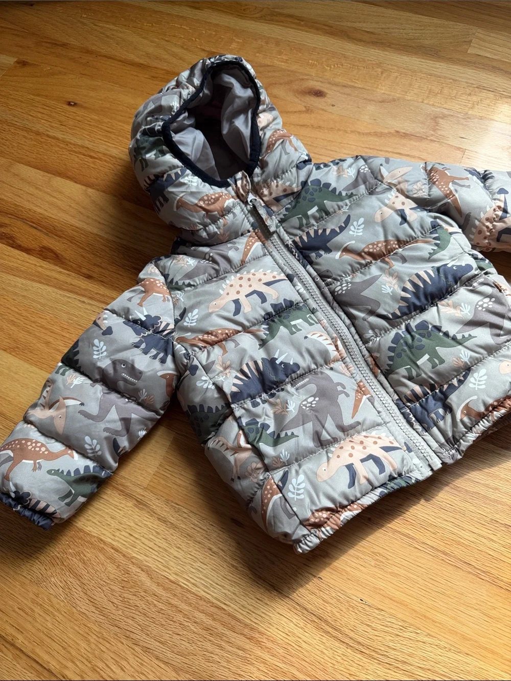 The Children's Place Dino Hooded Puffer Jacket in Tan, Green & Navy